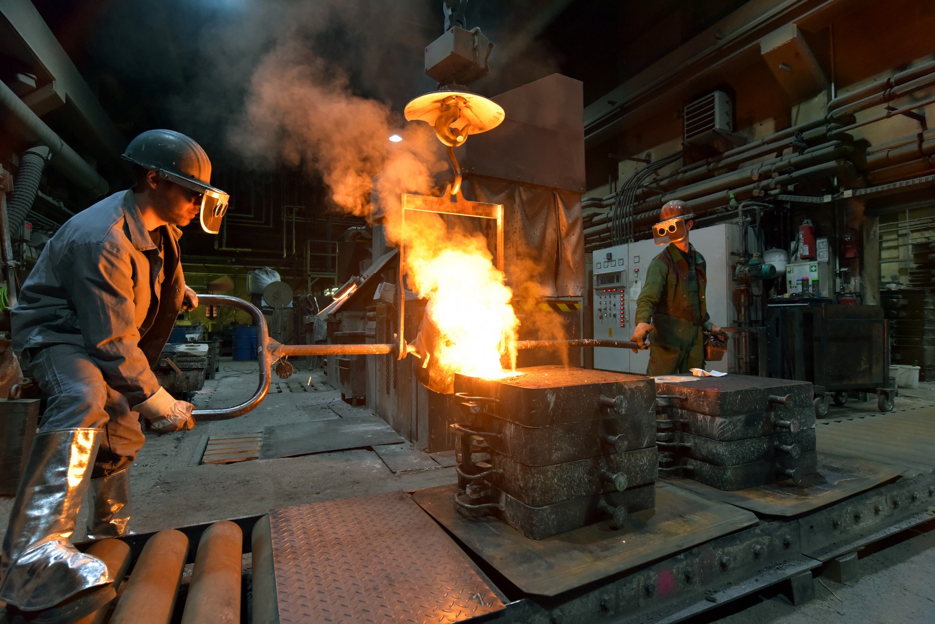 Workers,In,A,Foundry,Casting,A,Metal,Workpiece,-,Safety